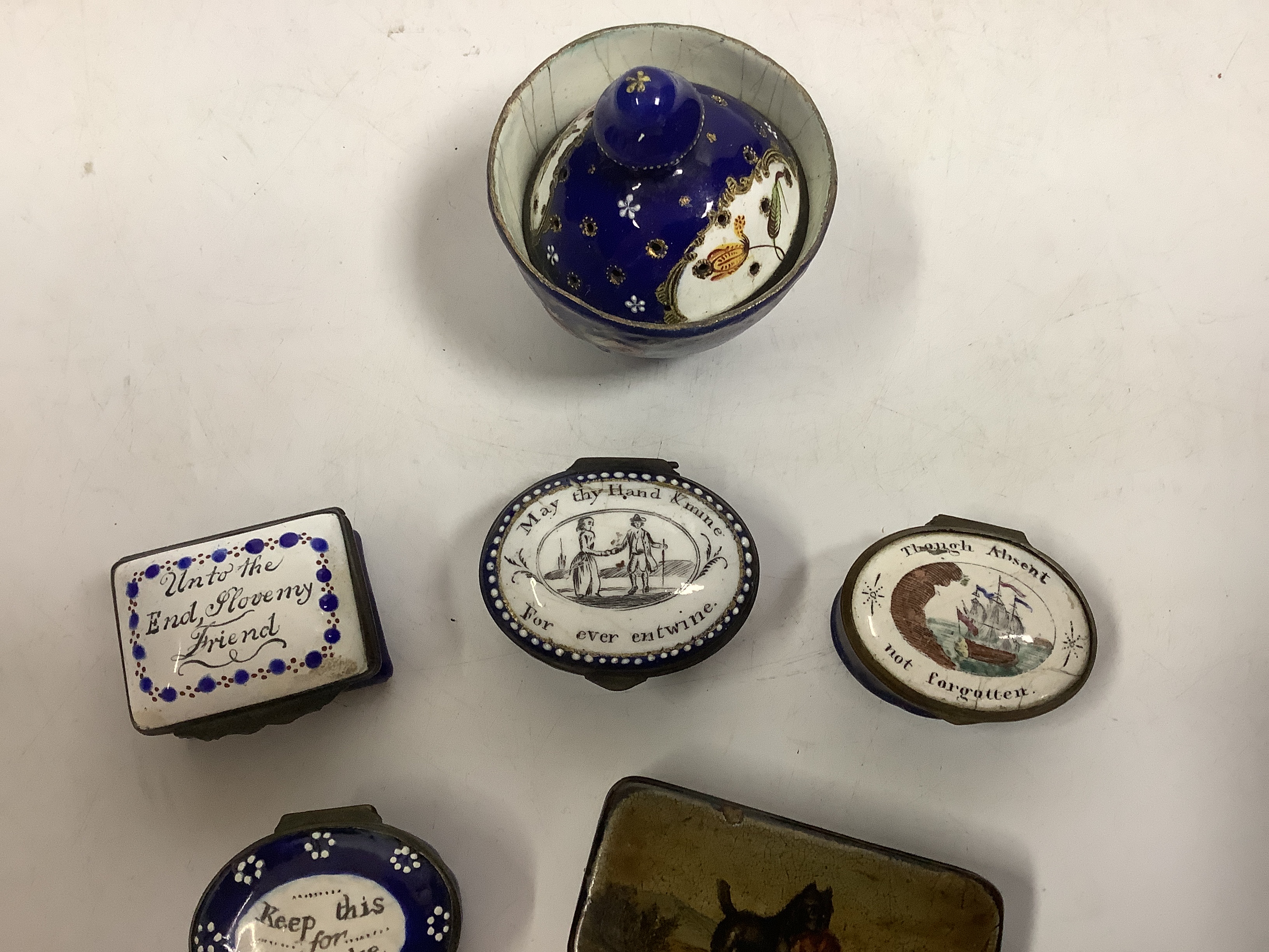 Two South Staffordshire enamel sweetheart patch boxes and two similar snuff boxes, three South Staffordshire enamel pill boxes, all late 18th/early 19th century, South Staffordshire enamel cup and associated cover and a